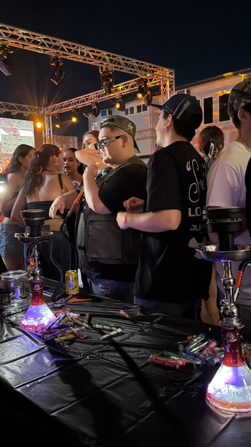 Guests gathered around the hookah table