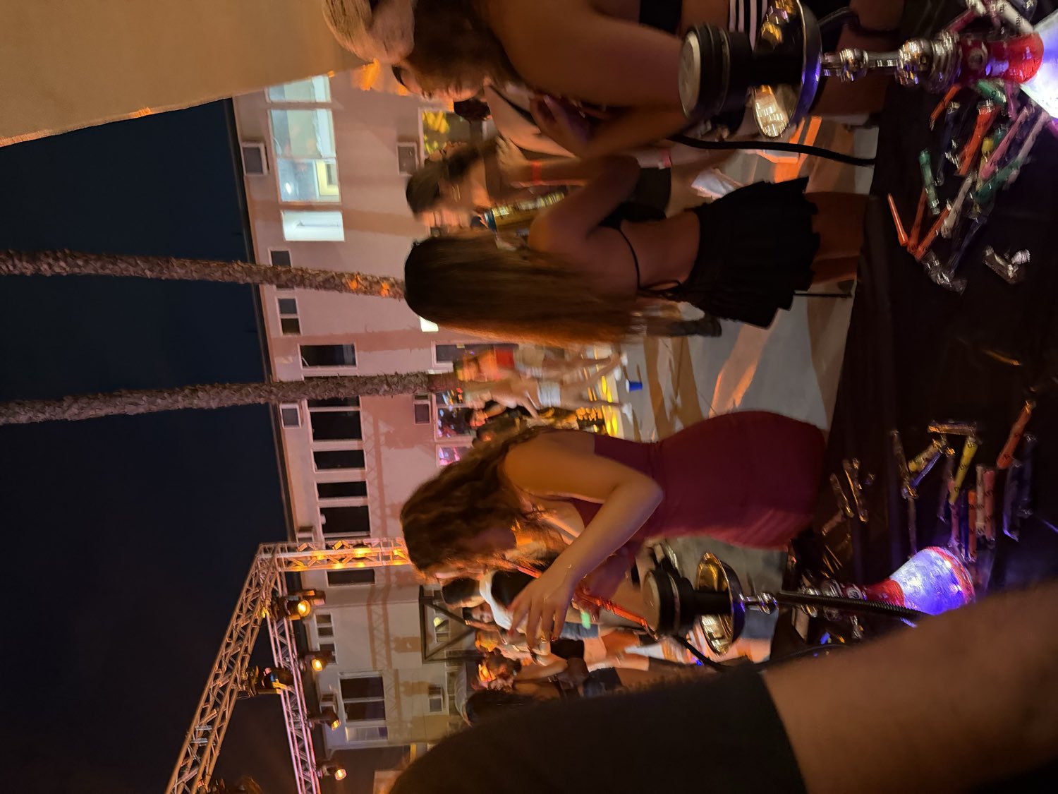 Guests enjoying hookah at an outdoor party